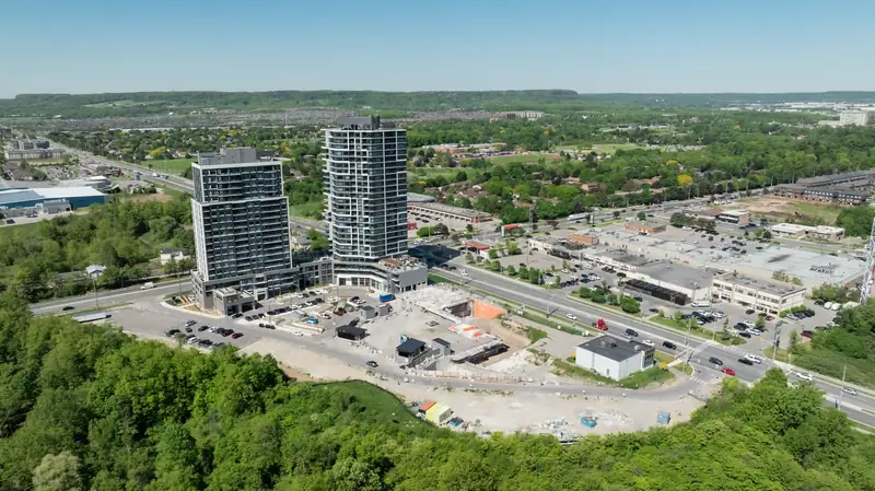 Aerial view of the Connectt towers beside a green ravine