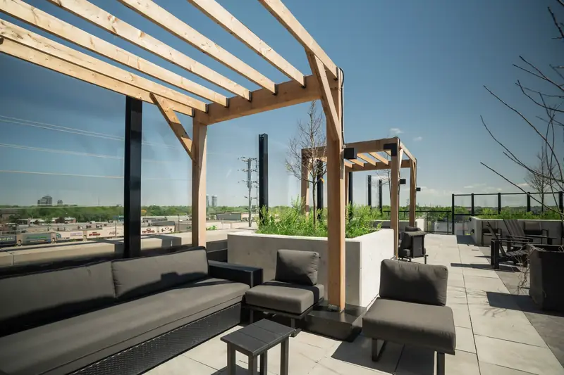 Wood pergola cabanas with outdoor sofas
