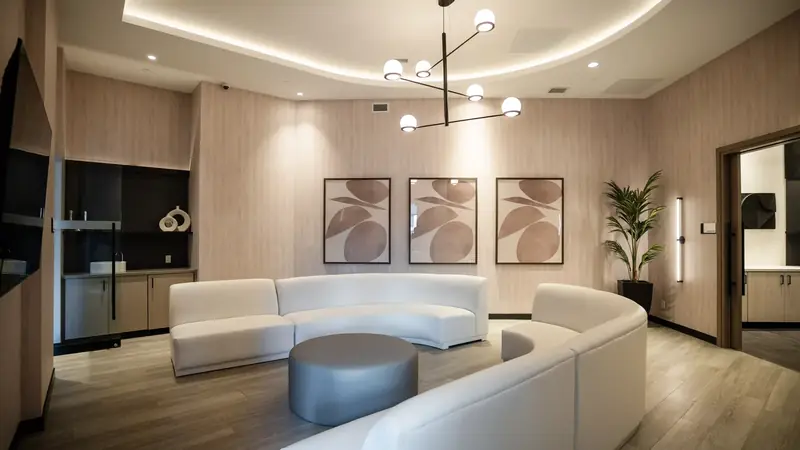 Lounge with curved sofa and pendant lighting