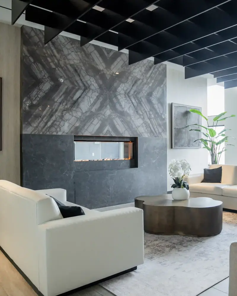 Connectt resident lounge with a stone feature wall, fireplace and sofas